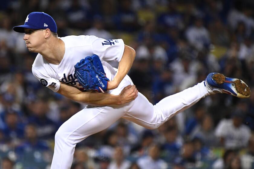 LOS ANGELES, CALIFORNIA OCTOBER 3, 2019-Dodgers pitcher Walker Buehler throws a pitch against the Nationals inthe 5th inning in Game 1 of the NLDS at Dodger Stadium Thursday. (Wally Skalij/Los Angeles Times)