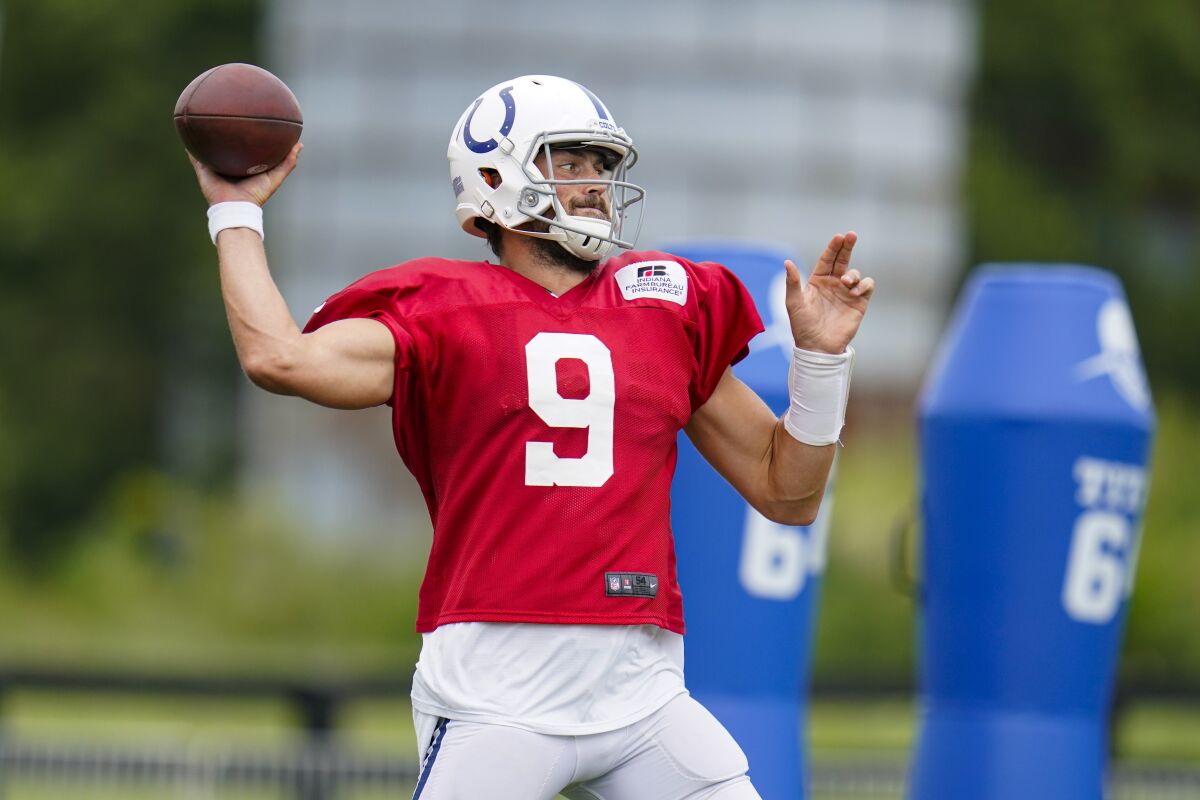 Indianapolis Colts quarterback Jacob Eason throws during a joint practice with the Carolina Panthers at the NFL team's football training camp in Westfield, Ind., Thursday, Aug. 12, 2021. (AP Photo/Michael Conroy)