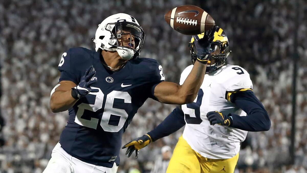 Penn State's Saquon Barkley pulls in a touchdown pass against Michigan on Oct. 21.