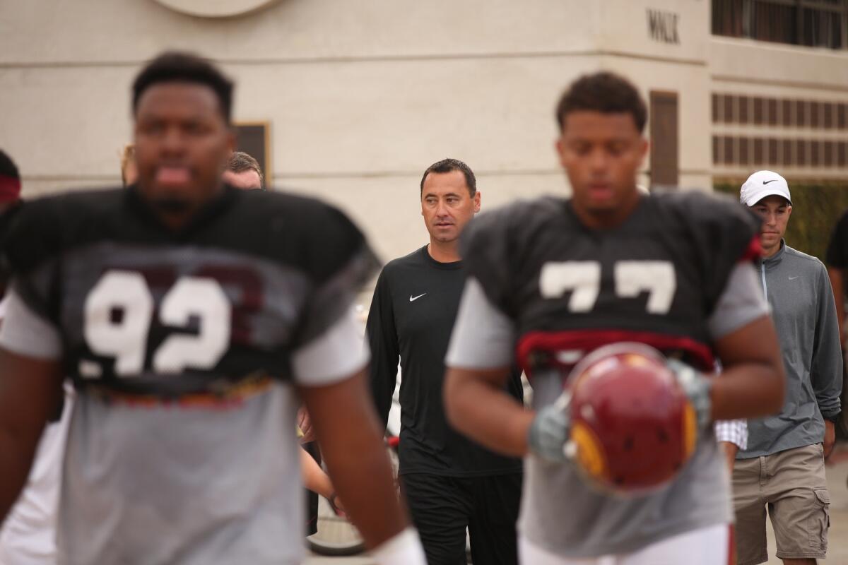 USC Coach Steve Sarkisian takes to the practice field on Aug. 25. The Trojans will play Arkansas State on Saturday in their season opener.
