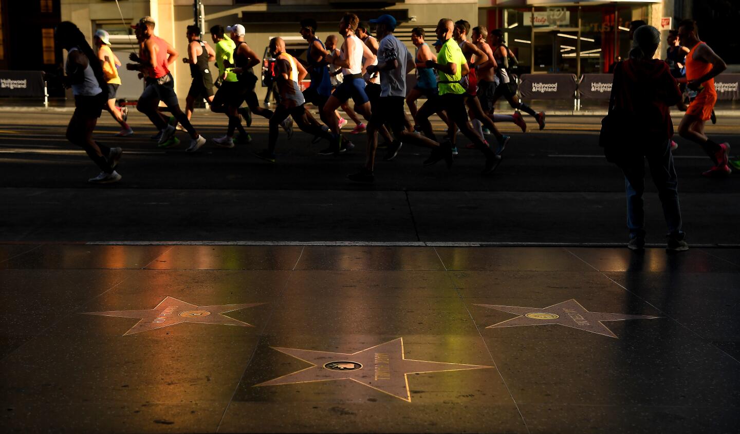 Competitors run along Hollywood Blvd. in Hollywood Sunday during L.A. Marathon.