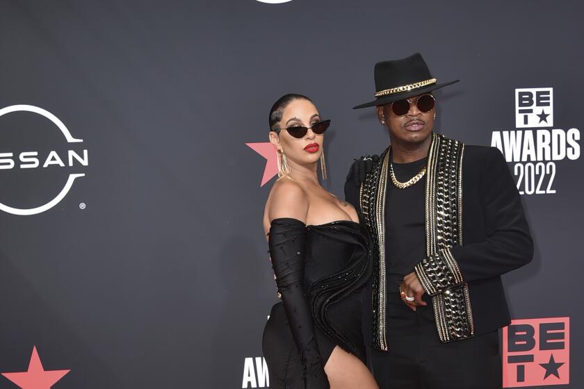Ne-Yo and Crystal Renay arrive at the BET Awards in Los Angeles. (Photo by Richard Shotwell/Invision/AP)