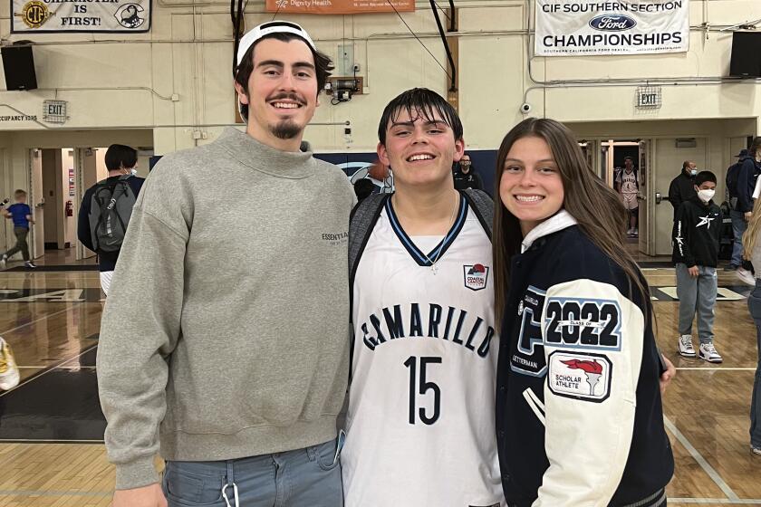 Jaime, left; Marcos and Gabriela Jaquez gather for a photo after one of Marcos' high school basketball games.