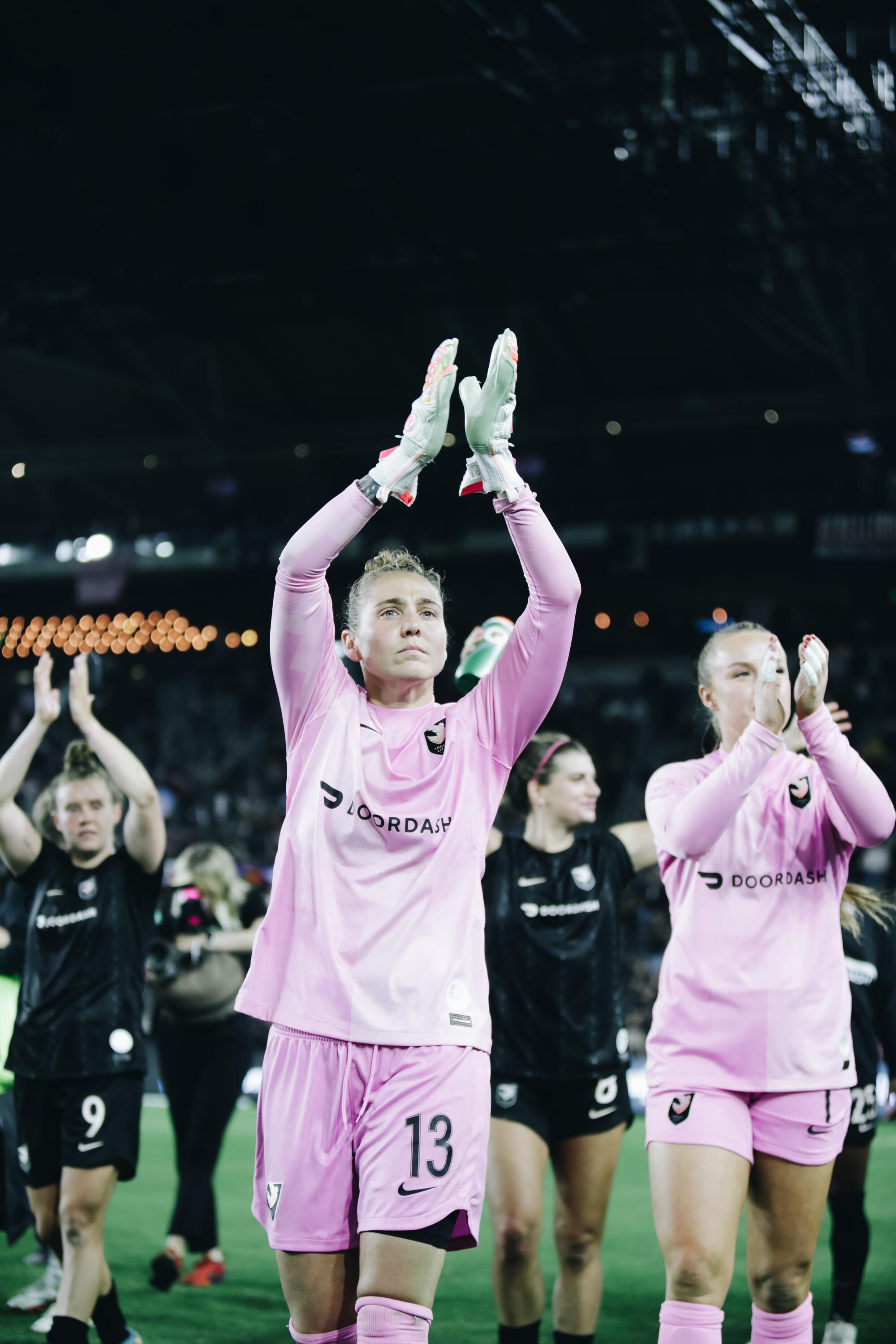 Angel City goalkeeper DiDi Haracic celebrates with teammates.