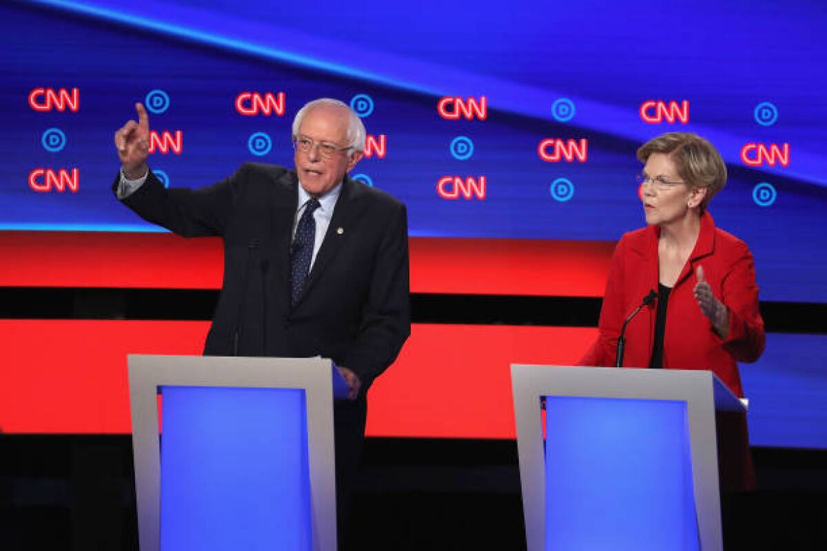 Sens. Bernie Sanders and Elizabeth Warren are two of the leading backers of “Medicare for all” plans that would eliminate job-based insurance in favor of a government-run plan.