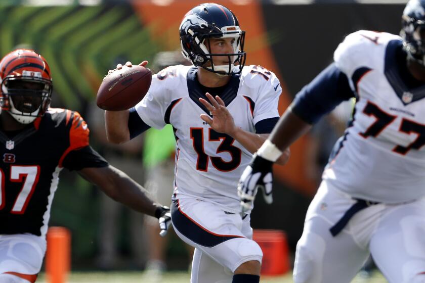 Broncos quarterback Trevor Siemian steps up in the pocket to pass against the Bengals during a game Sept. 25.