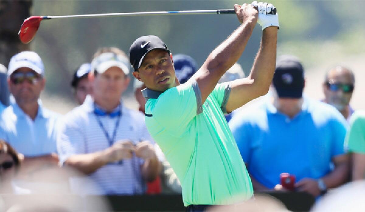 Tiger Woods made eight birdies for a 66 on Saturday and was only three shots off the lead going into the final round of the World Golf Championship in Doral.