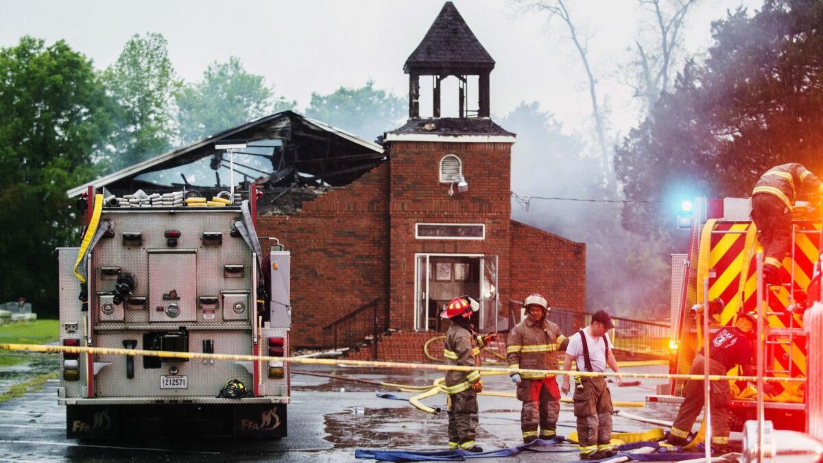 Firefighters and fire investigators respond April 4 to Mount Pleasant Baptist Church in Opelousas, La.