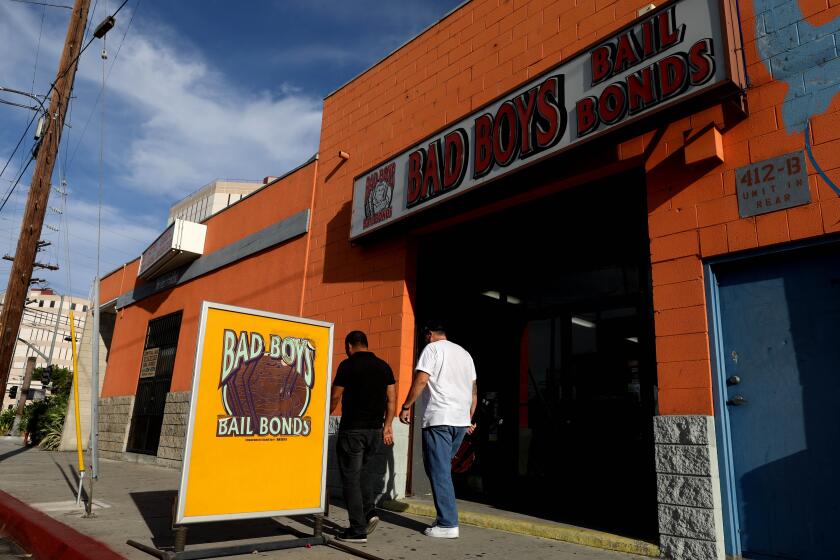 LOS ANGELES, CALIF. -- THURSDAY, AUGUST 30, 2018: Bad Boys Bail Bonds is located across the street from the Los Angeles County Jail in Los Angeles, Calif., on Aug. 30, 2018. Gov. Jerry Brown signed Senate Bill 10, replacing bail with “risk assessments” of individuals and non-monetary conditions of release. The change, which will take effect in October 2019. (Gary Coronado / Los Angeles Times)