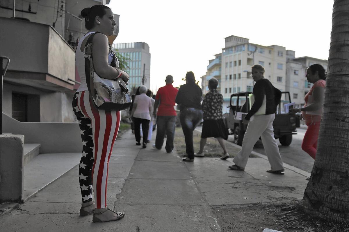 People file toward the U.S. Embassy in Havana to apply for tourist visas.