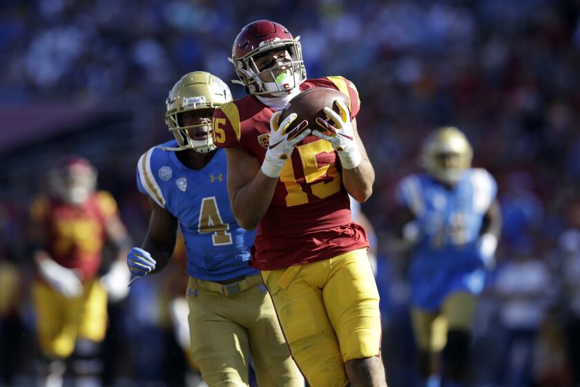 Southern California wide receiver Drake London (15) makes a catch against UCLA during the first half of an NCAA college football game Saturday, Nov. 23, 2019, in Los Angeles. (AP Photo/Marcio Jose Sanchez)