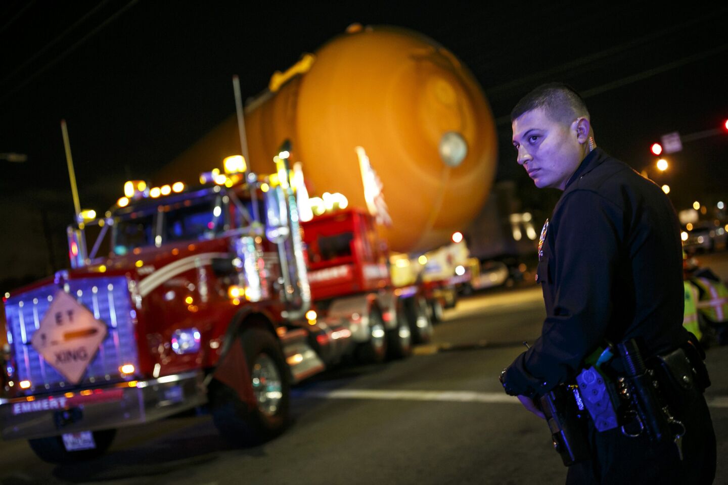 Police stand by as shuttle fuel tank ET-94 makes a turn onto Mindanao Way on its slow journey to Exposition Park.