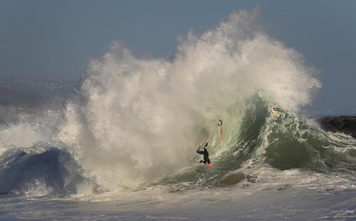 NEWPORT BEACH, CALIF. -- MONDAY, JUNE 11, 2018: A surfer wipes out while riding a big wave at The Wedge in Newport Beach, Calif., on June 11, 2018. Large waves and strong rip currents will continue through Tuesday at south-facing beaches. (Allen J. Schaben / Los Angeles Times)