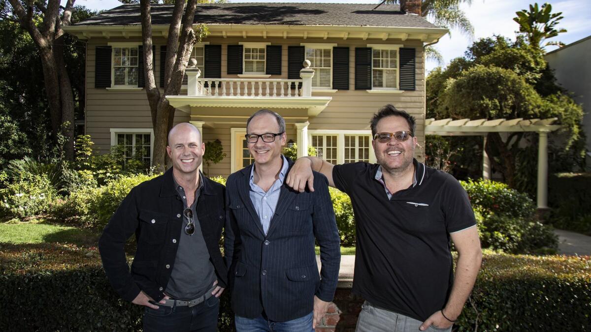 Producer Tripp Vinson, from left, director Nicholas McCarthy and writer Jeff Buhler, the filmmakers behind "The Prodigy," in front of the home used in the original "Halloween" film.