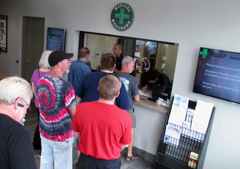 People line up to purchase medical marijuana at the Silver State Relief dispensary in Sparks, Nev.