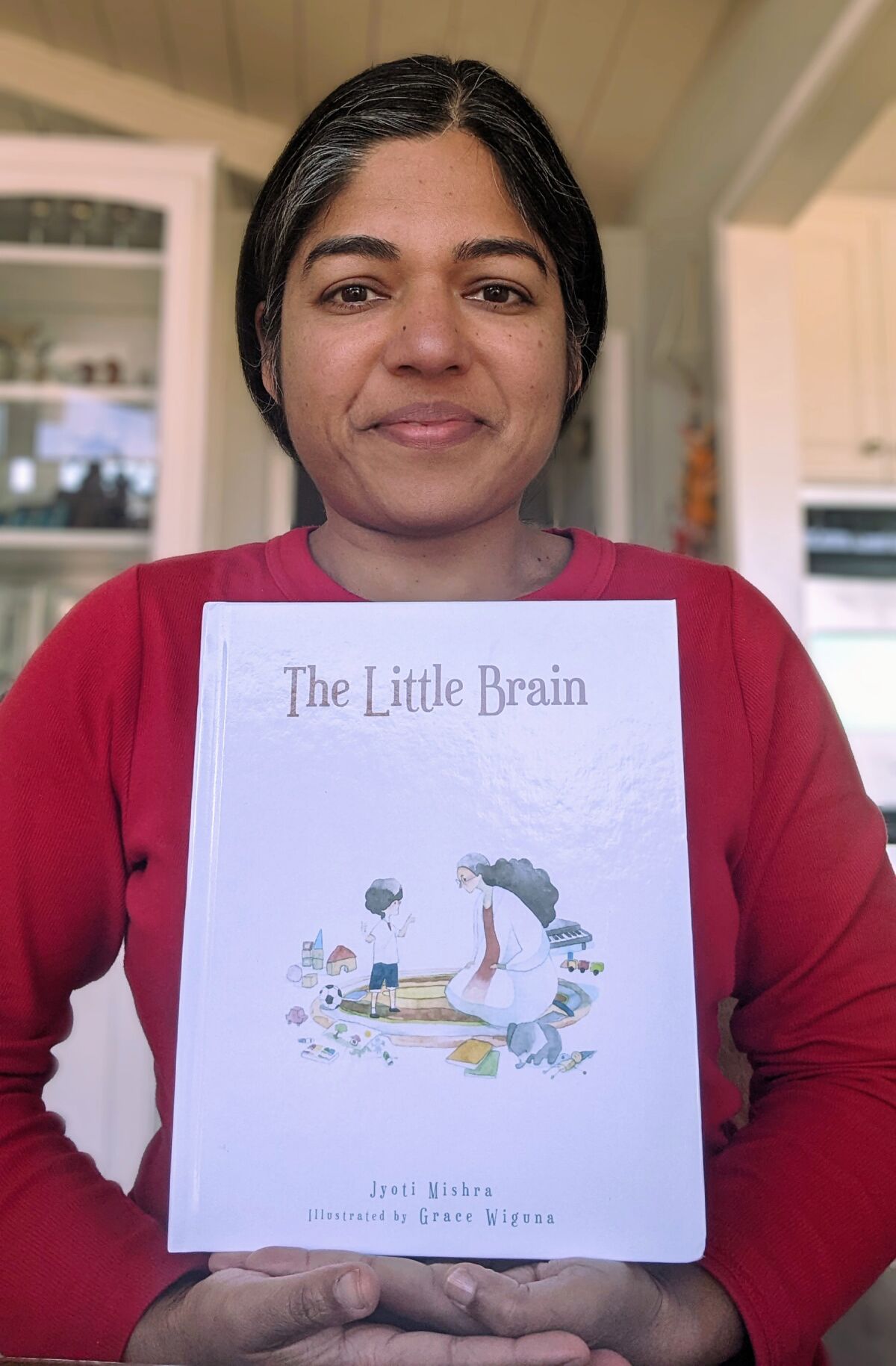 Pacific Beach resident Jyoti Mishra with her first children's book, "The Little Brain."