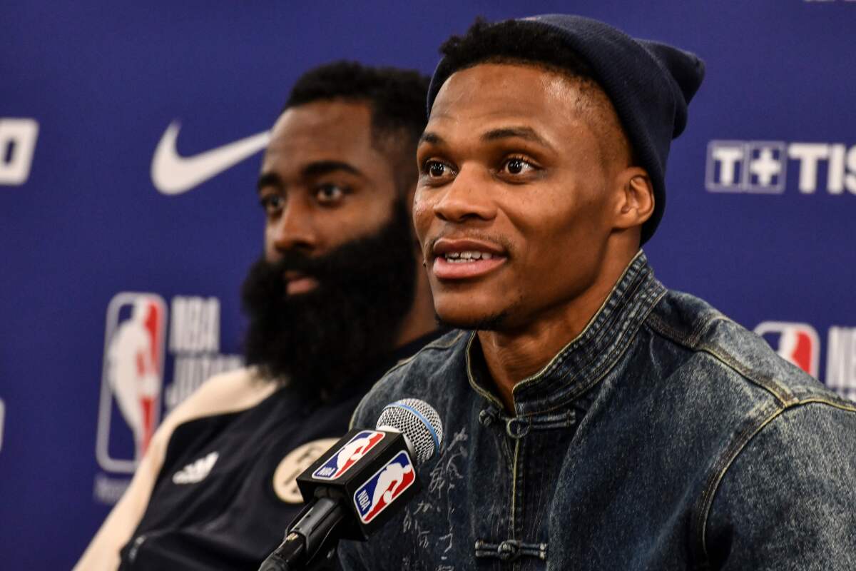Houston's Russell Westbrook, right, and James Harden speak with reporters Thursday after a preseason game against the Toronto Raptors in Tokyo.