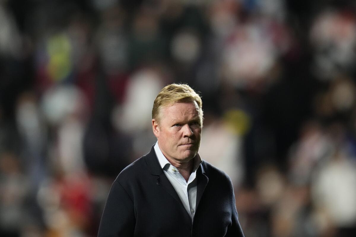 Barcelona's head coach Ronald Koeman heads back down the tunnel at half time during a Spanish La Liga soccer match between Rayo Vallecano and FC Barcelona at the Vallecas stadium in Madrid, Spain, Wednesday, Oct. 27, 2021. (AP Photo/Manu Fernandez)