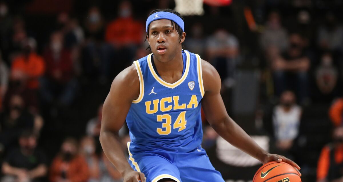 UCLA guard David Singleton plays during an NCAA college basketball game