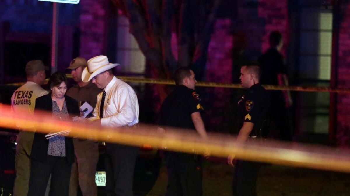 Authorities work at the scene of a shooting that killed at least eight people in Plano. Texas, on Sept. 10.