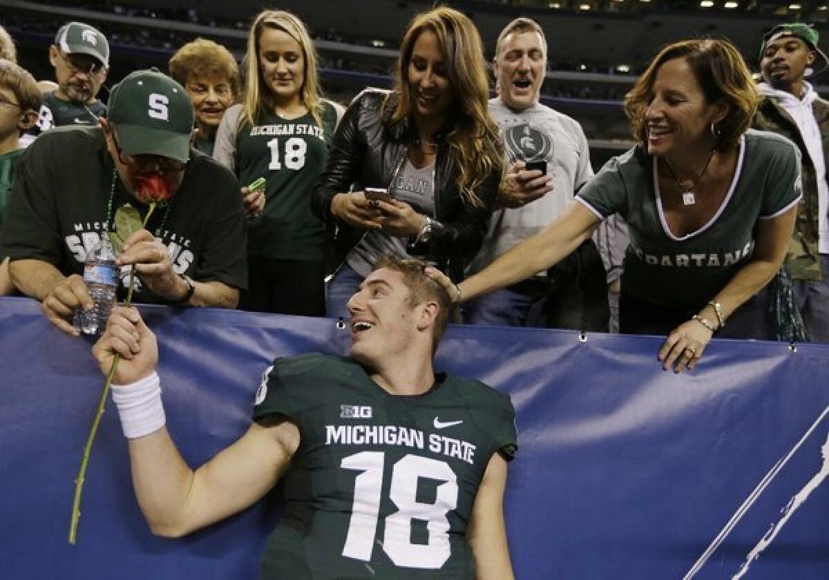 Michigan State fans will go to great lengths to support their team, including quarterback Connor Cook, in the Rose Bowl game.