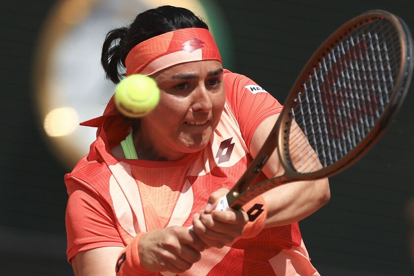 Tunisia's Ons Jabeur plays a shot against Italy's Lucia Bronzetti during their first round match of the French Open tennis tournament at the Roland Garros stadium in Paris, Tuesday, May 30, 2023. (AP Photo/Aurelien Morissard)
