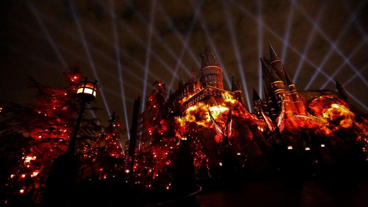 "The Nighttime Lights at Hogwarts TM Castle" Gryffindor House imagery is projected against Hogwarts Castle against a web of spot lights as part of the new light show for, "The Wizarding World of Harry Potter," at Universal Studios.