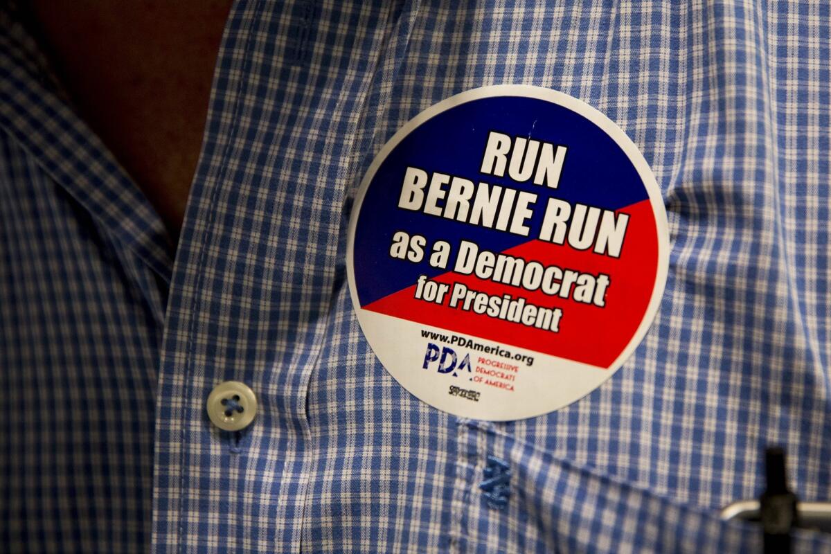 An audience member wears a campaign button for Sen. Bernie Sanders, who announced his candidacy for the Democratic presidential nomination on April 30, at a town hall meeting in Maryland on May 5.