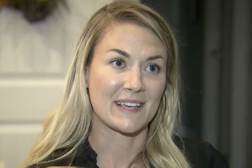 In this image taken from video provided by WRAL-TV, Capt. Emily Rainey speaks during an interview with WRAL-TV, in Southern Pines, N.C., in May 2020. The Army is investigating Rainey, a psychological operations officer, who led a group of people from North Carolina to the rally in Washington that led to the deadly riot in the U.S. Capitol by supporters of President Donald Trump. (Courtesy of WRAL-TV via AP)