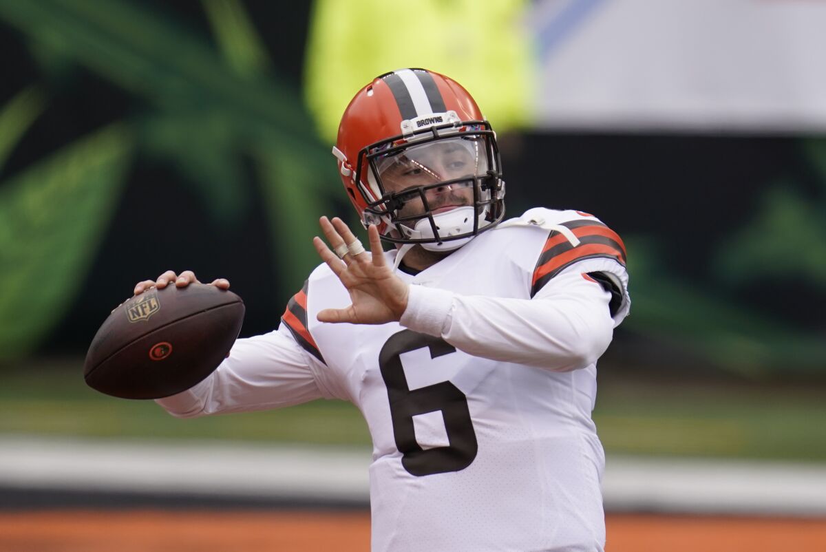 Cleveland Browns quarterback Baker Mayfield throws before an NFL football game against the Cincinnati Bengals, Sunday, Oct. 25, 2020, in Cincinnati. (AP Photo/Michael Conroy)
