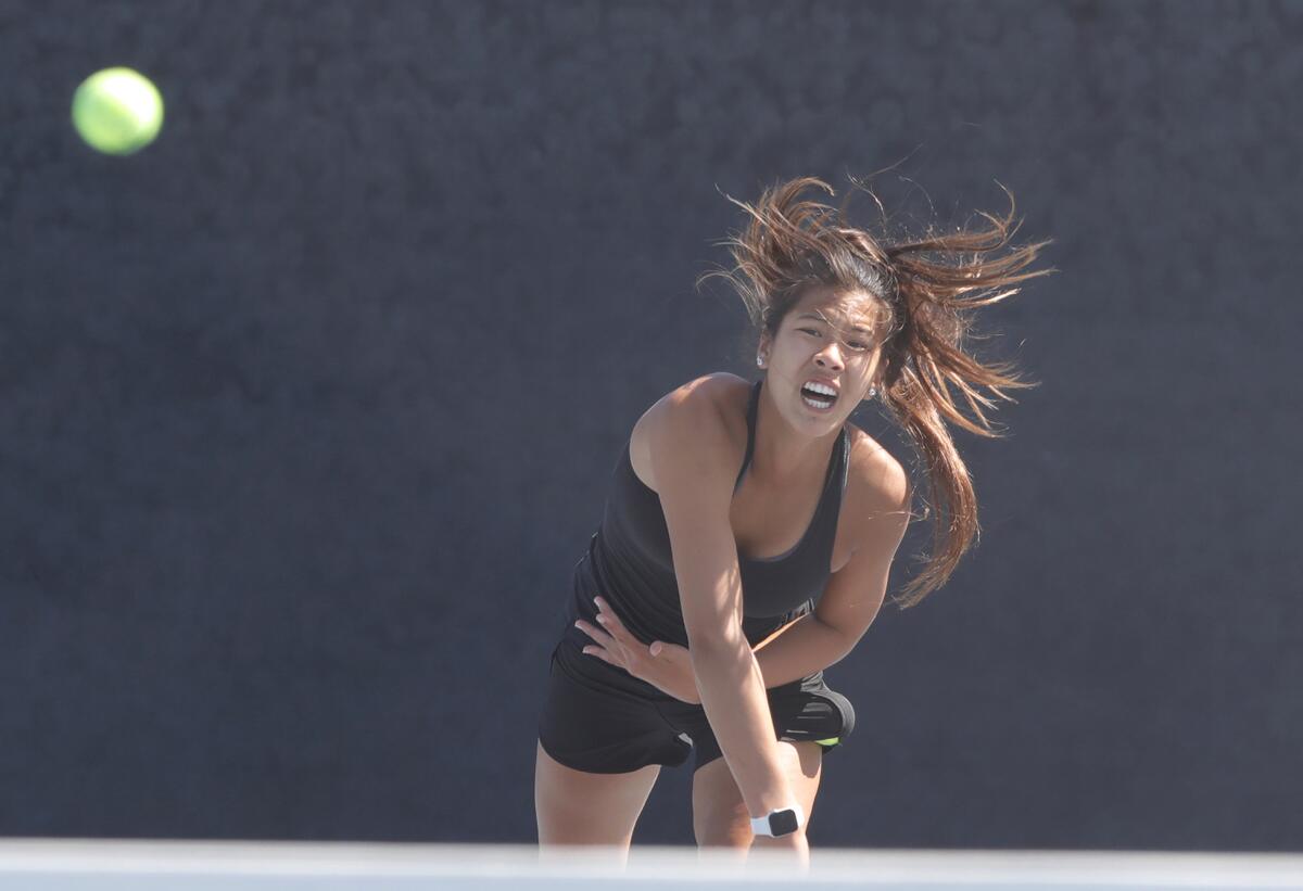 Huntington Beach singles player Cindy Huynh rips a serve on Tuesday.