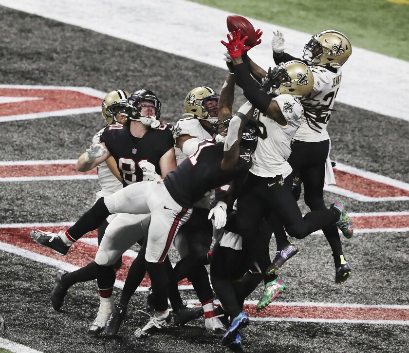 A pass to Atlanta Falcons wide receiver Julio Jones falls incomplete in the end zone as time expires with the New Orleans Saints defending in an NFL football game Sunday, Dec. 6, 2020, in Atlanta. (Curtis Compton/Atlanta Journal-Constitution via AP)