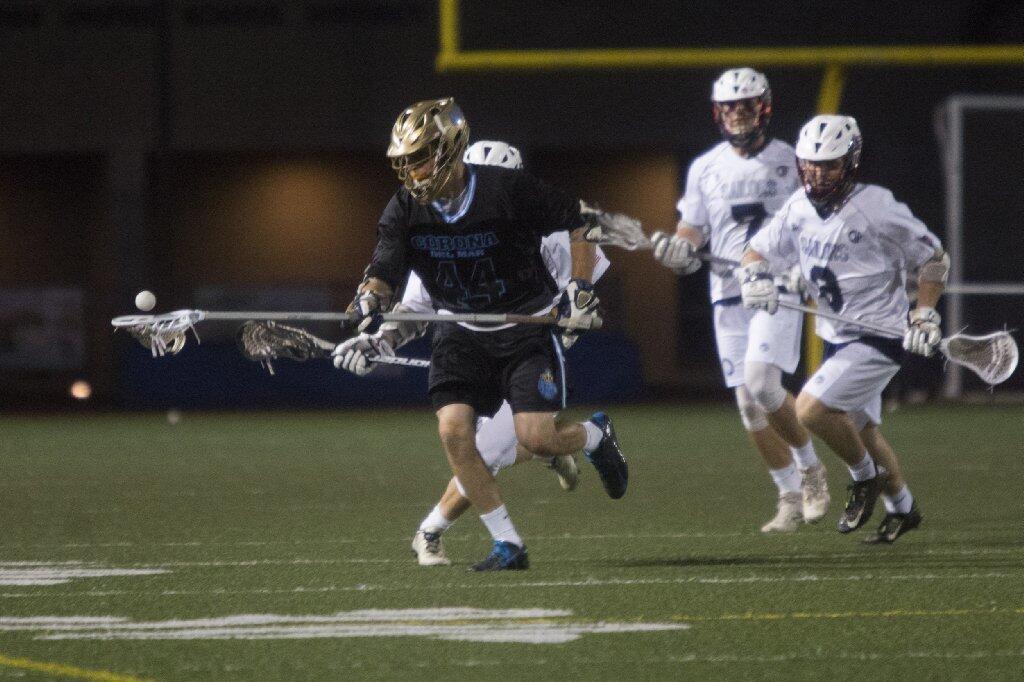 Corona del Mar's Brennan Greenwald gains possession of the ball during the Battle of the Bay against Newport Harbor.