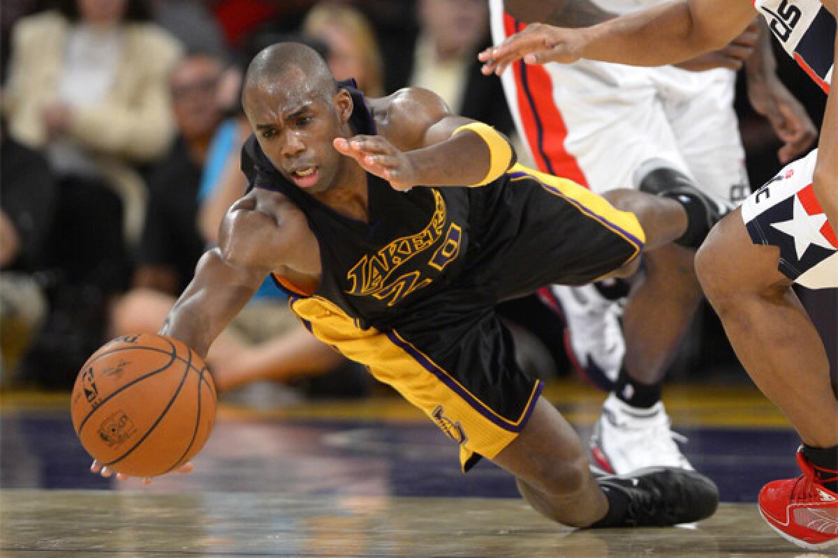 The Lakers' Jodie Meeks dives for a loose ball against Washington in March.