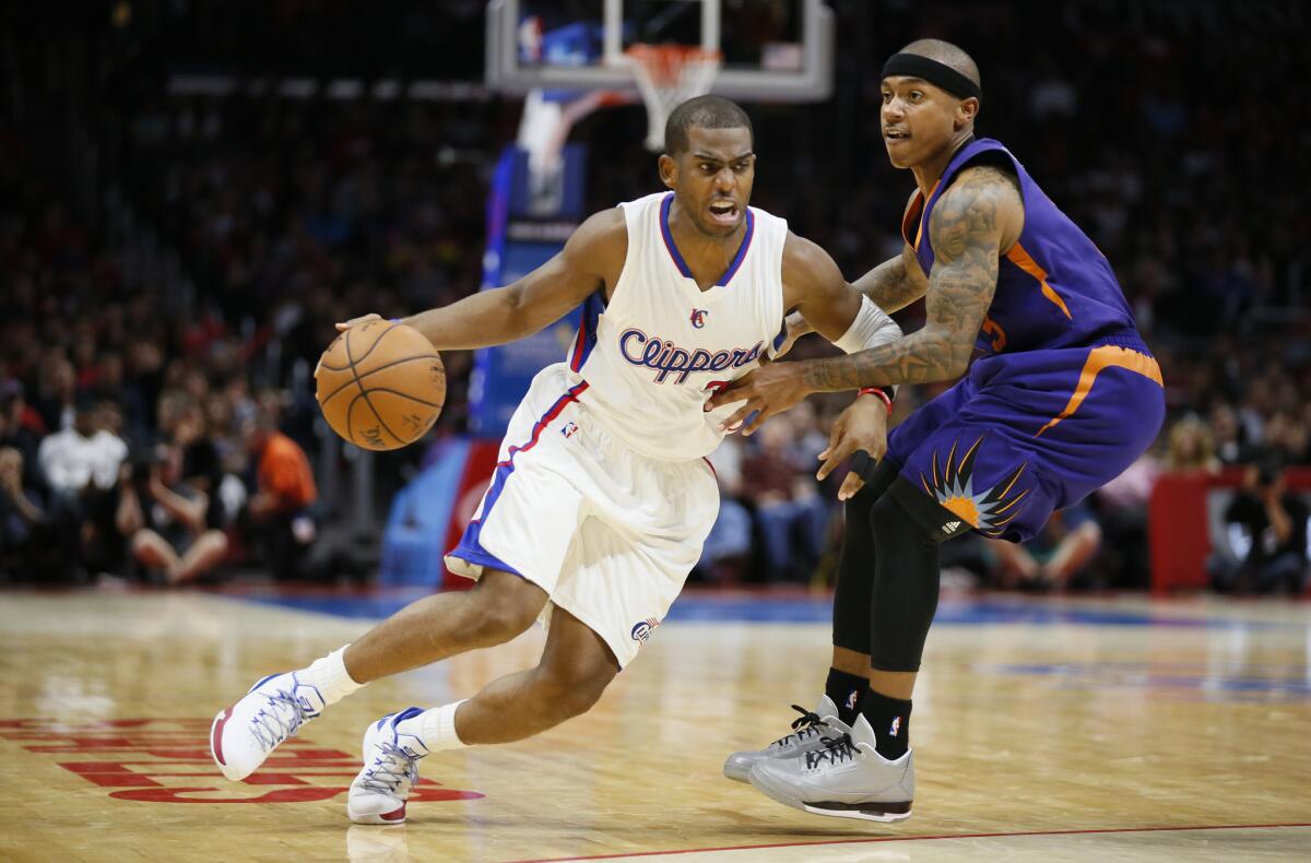 The Clippers' Chris Paul takes on Phoenix's Isaiah Thomas during a Nov. 15 game at Staples Center.