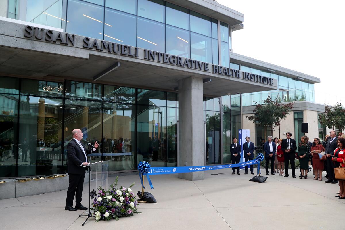 Howard Gillman, left, Chancellor of the University of California Irvine, speaks.