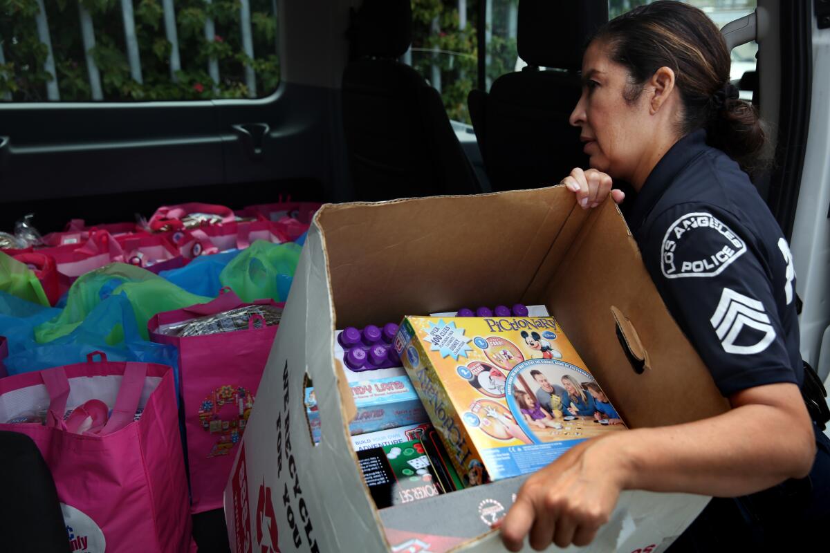Sgt. Catherine Plows organizes donation items at LAPD Harbor Station in San Pedro.