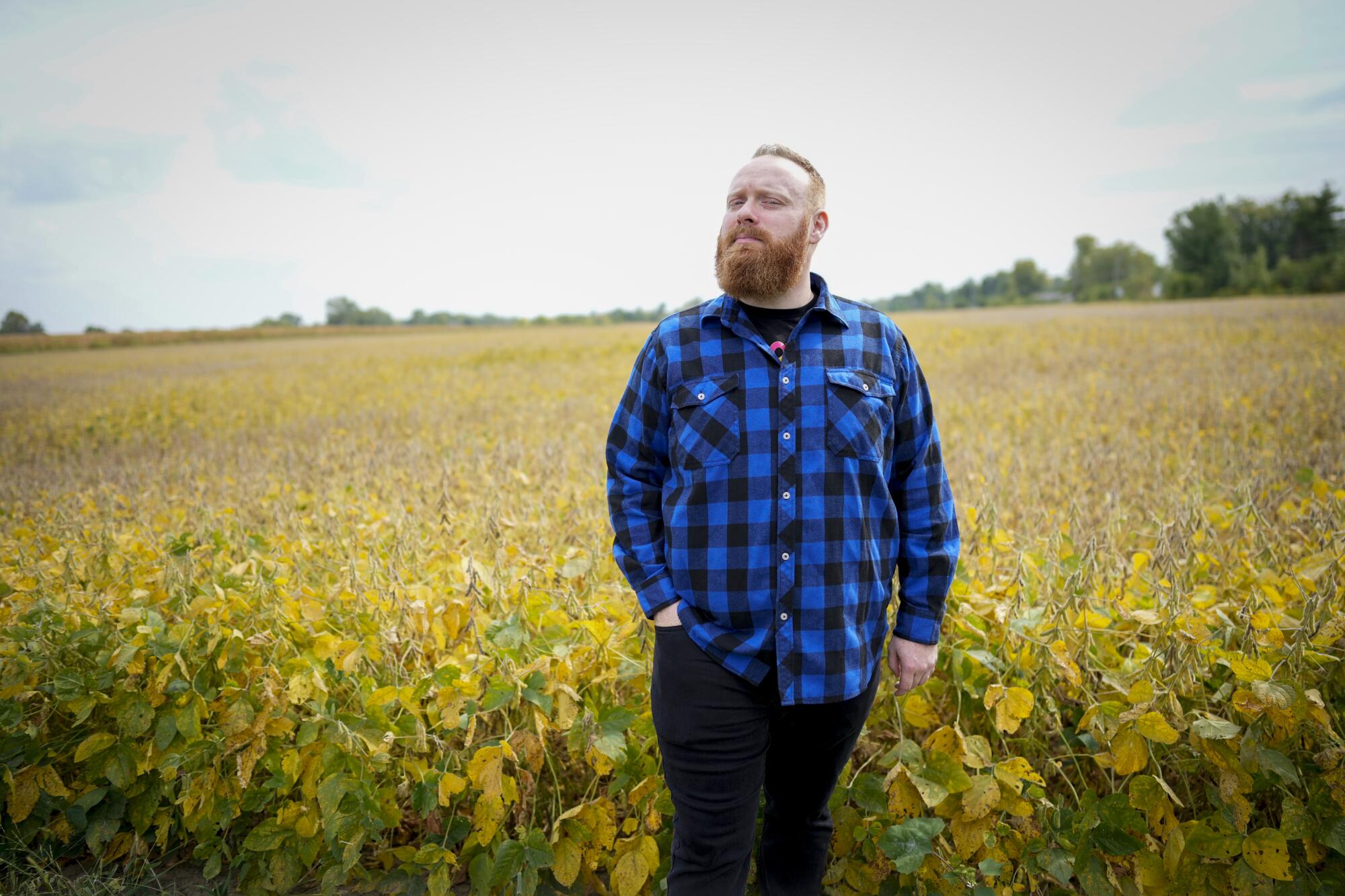 Brent Terhune poses for a portrait in a field near his home in Indiana.