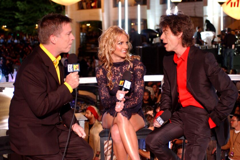 Kurt Loder, Britney Spears and Mick Jagger during 2001 MTV Video Music Awards