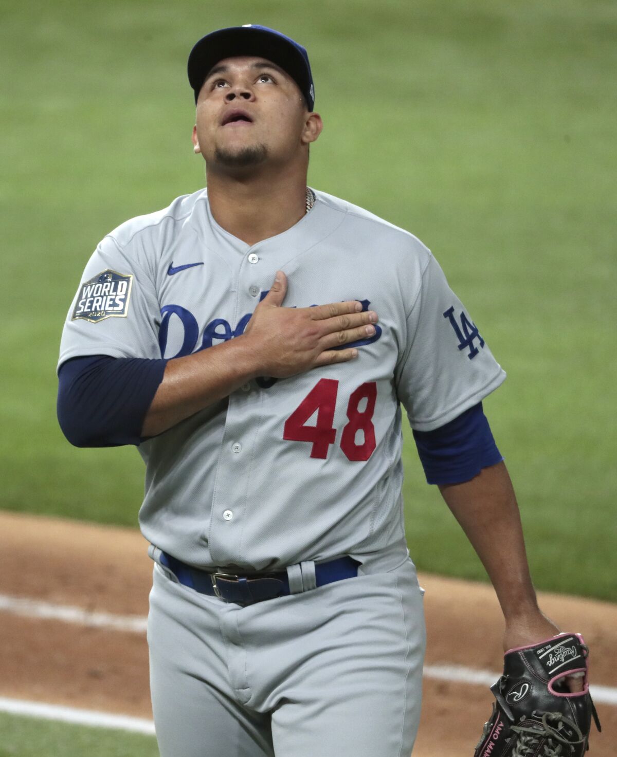 Dodgers relief pitcher Brusdar Graterol looks skyward after pitching a scoreless eighth inning.