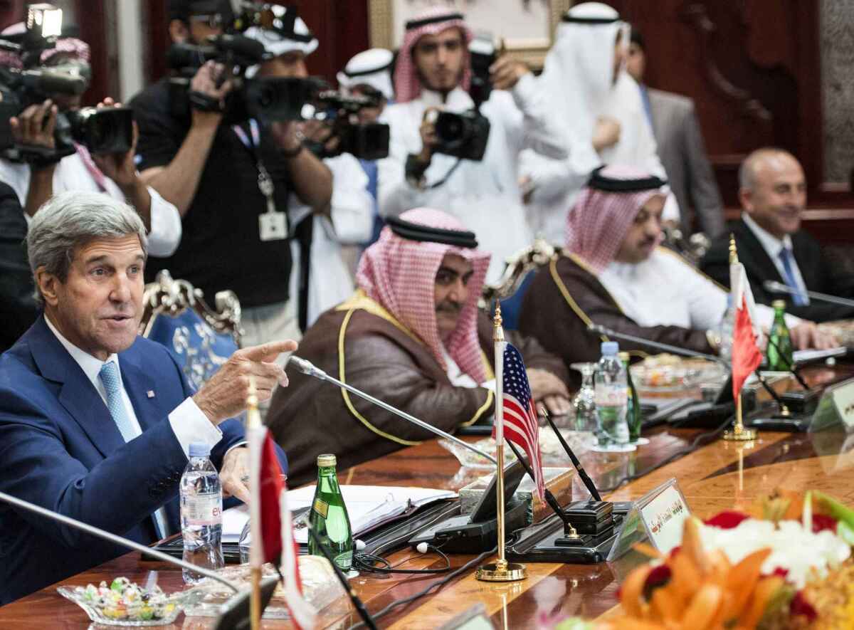 Secretary of State John Kerry talks with other attendees before the start of a Gulf Cooperation Council and Regional Partners meeting in Jeddah September 11, 2014. Kerry will press Arab leaders on Thursday to support President Barack Obama's plans for a new military campaign against Islamic State militants including help with greater overflight rights for U.S. warplanes.