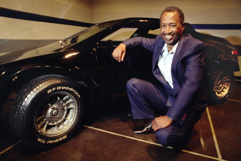 Cliff Hall with his Getaway sports car at the Peterson Automotive Museum.