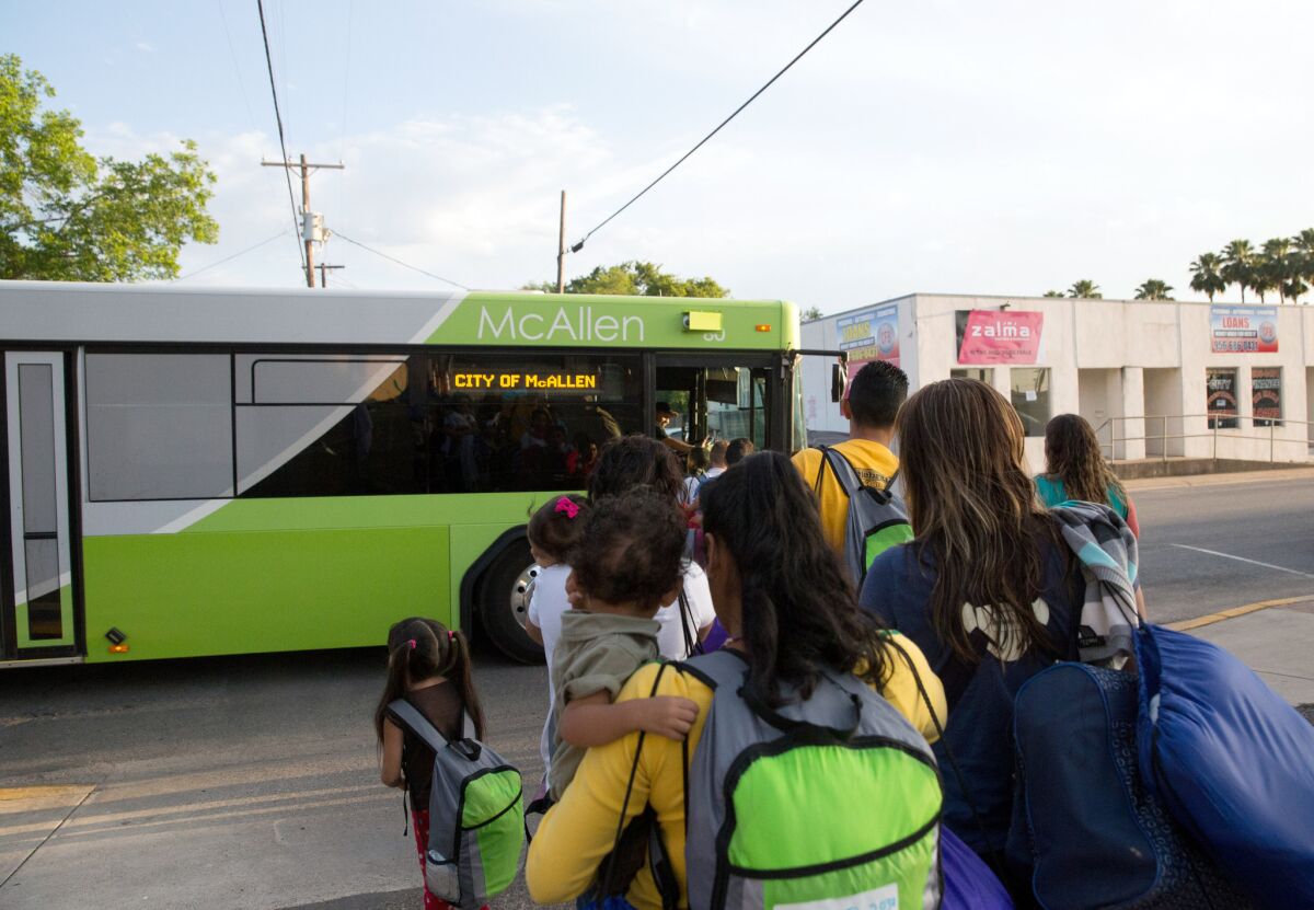 Immigrant families, many of them mothers with children, board a bus in April headed to McAllen, Texas. The immigrants had crossed the Rio Grande and were later released from Border Patrol custody with notices to appear in immigration court.