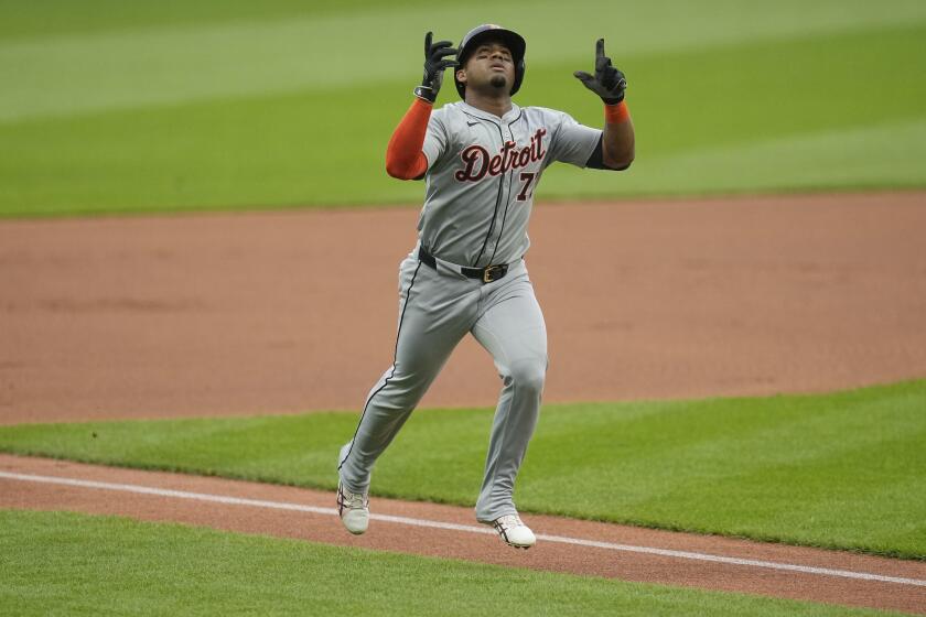 Detroit Tigers' Andy Ibáñez gestures as he nears home plate with a home run against the Cleveland Guardians during the first inning of a baseball game Tuesday, May 7, 2024, in Cleveland. (AP Photo/Sue Ogrocki)
