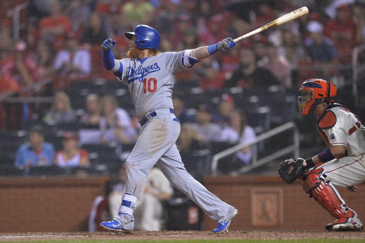 Dodgers' Justin Turner hits a double in the sixth inning Saturday against the St. Louis Cardinals.