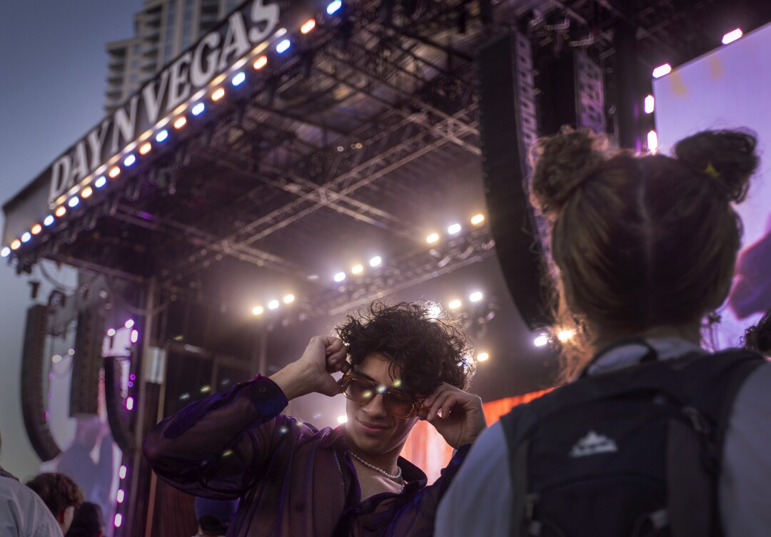 Jonathan Alvidrez of Phoenix, dances as Morray performs at the Day N Vegas hip-hop music festival.