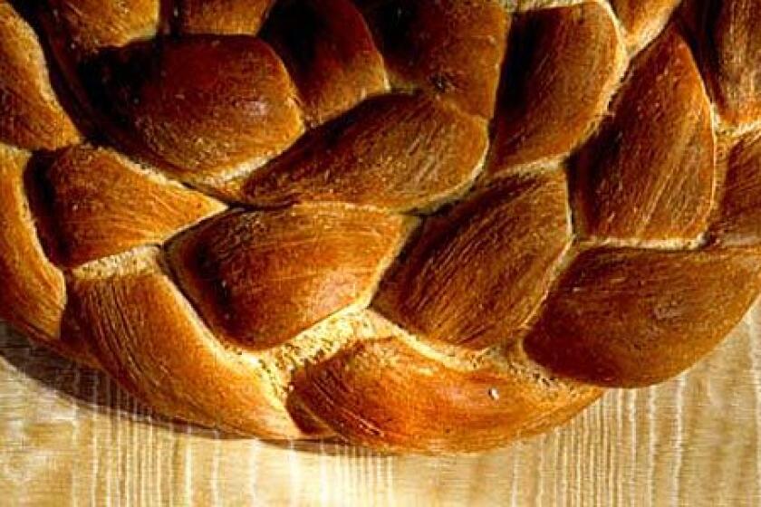 TOASTY PALETTE: The wheat-brown wreath of braided breads -- one seasoned with rosemary, the other spiked with pepper -- surprises and delights.
