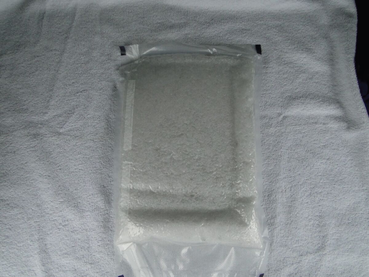 A small plastic bag containing white powder