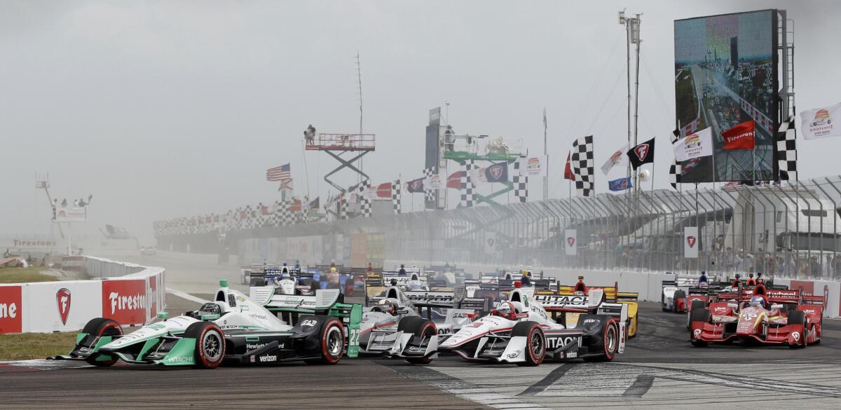 Simon Pagenaud (22) of France leads the field into Turn 1 during the start of the IndyCar Firestone Grand Prix of St. Petersburg on March 13.
