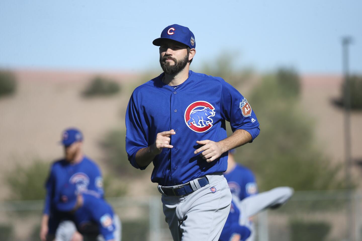Jason Hammel warms up with other players during spring training, Feb. 25, 2016.
